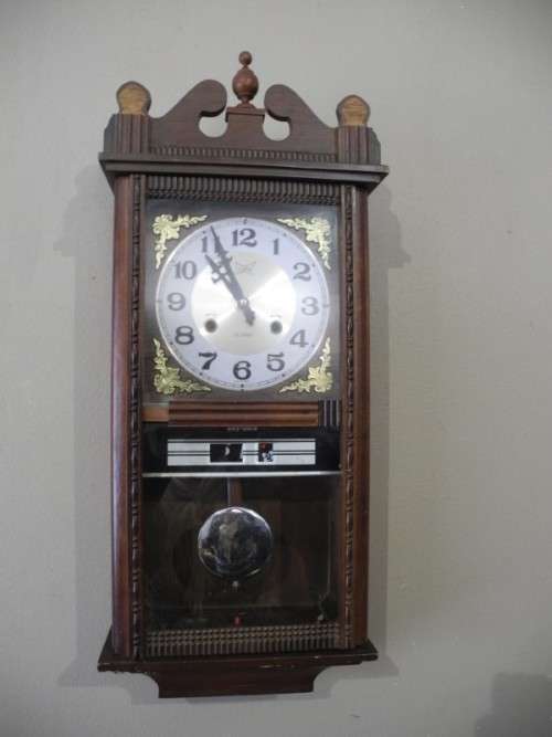 BARGAIN CLOCKS!!A vintage Blessing 31 day clock w/ day & date in a wood wall casing. Lifespace Sale
