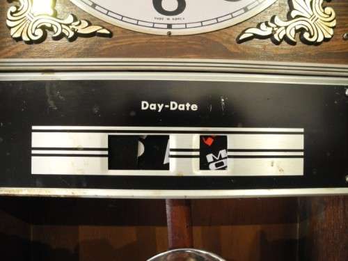 BARGAIN CLOCKS!!A vintage Blessing 31 day clock w/ day & date in a wood wall casing. Lifespace Sale