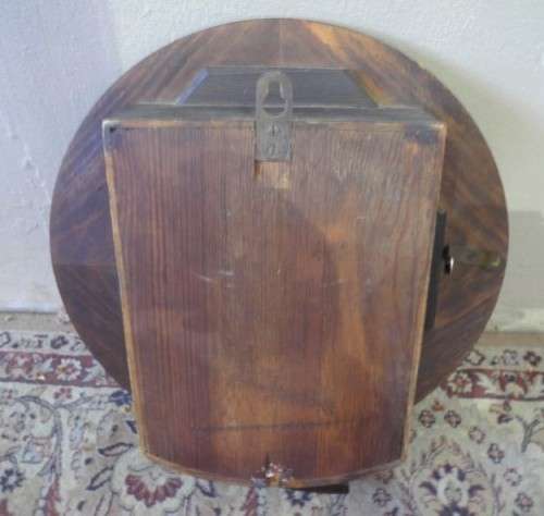 BARGAIN CLOCKS!!A vintage round Schulitis Schwar clock in a wood wall casing. Lifespace Sale