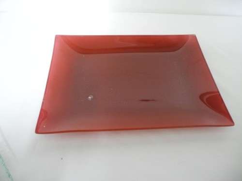 Four modern glass serving plates incl a red and black plate. Lifespace Sale