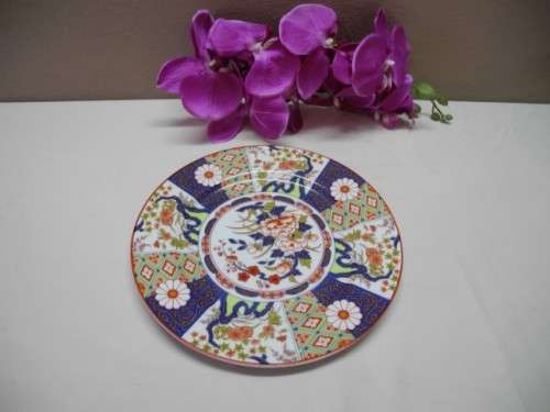 A colourful collection of various plates of different styles on a mixed table-Lifespace Sale