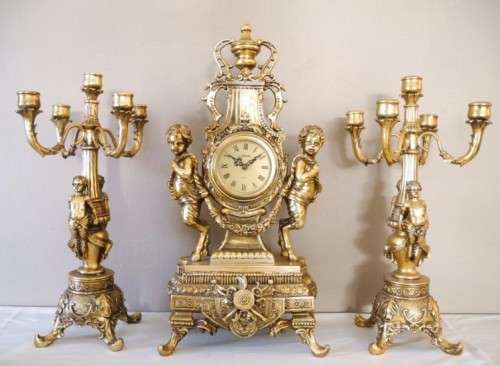 A magnificent 3 Piece French gold resin Clock Garniture, with a Juliana Quartz clock Beautiful!!!