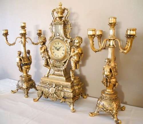A magnificent 3 Piece French gold resin Clock Garniture, with a Juliana Quartz clock Beautiful!!!