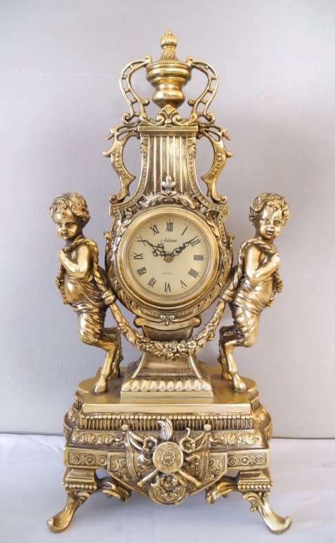 A magnificent 3 Piece French gold resin Clock Garniture, with a Juliana Quartz clock Beautiful!!!