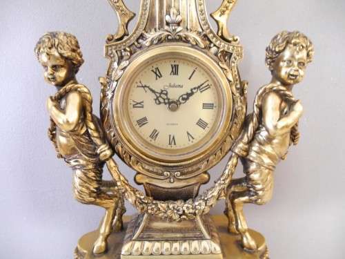 A magnificent 3 Piece French gold resin Clock Garniture, with a Juliana Quartz clock Beautiful!!!