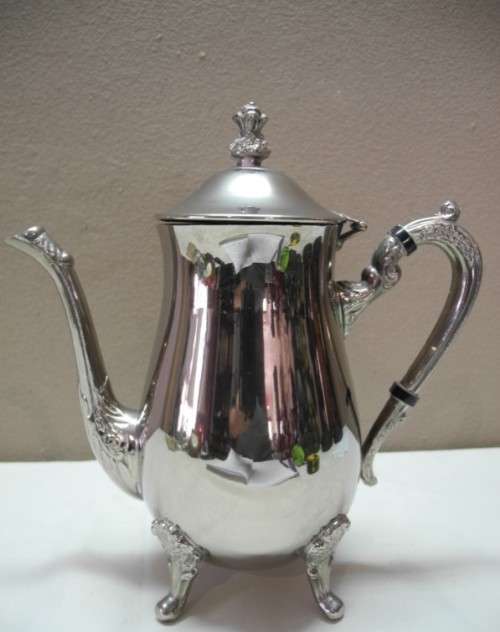 A wonderful ornate vintage silver plated teapot w/ a finial lid in good condition.