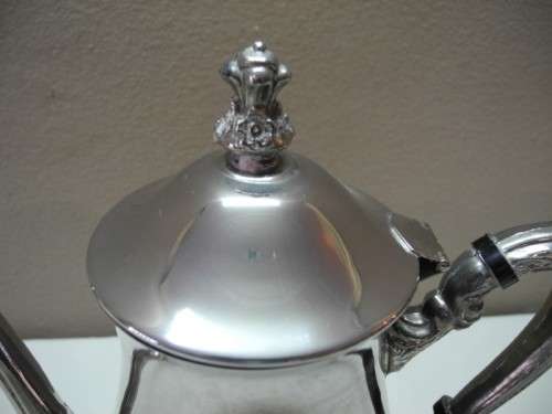 A wonderful ornate vintage silver plated teapot w/ a finial lid in good condition.