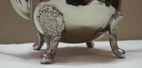 A wonderful ornate vintage silver plated teapot w/ a finial lid in good condition.
