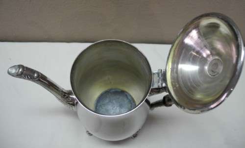 A wonderful ornate vintage silver plated teapot w/ a finial lid in good condition.