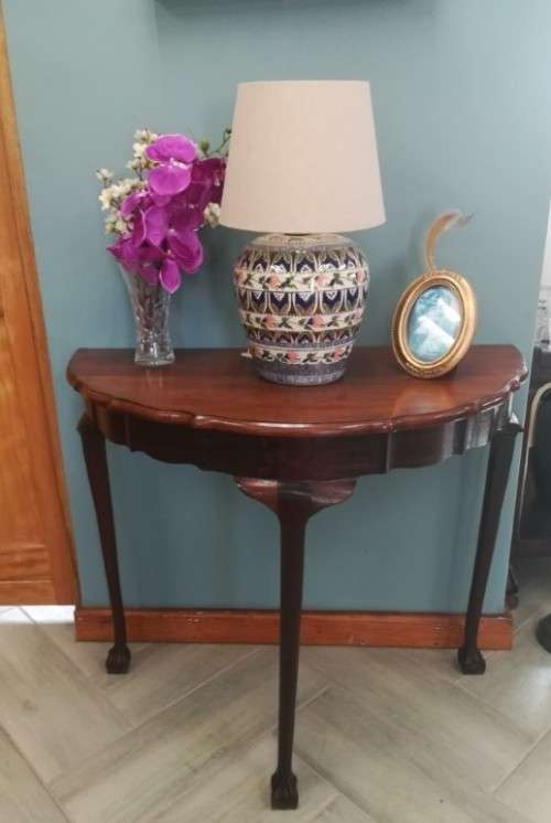 A  vintage solid Imbuia scalloped edge ball & claw half moon display/ occ table.Xmas sale