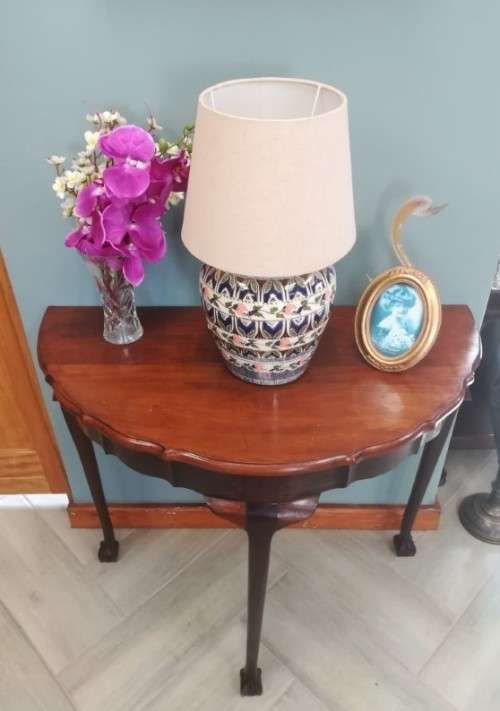 A  vintage solid Imbuia scalloped edge ball & claw half moon display/ occ table.Xmas sale