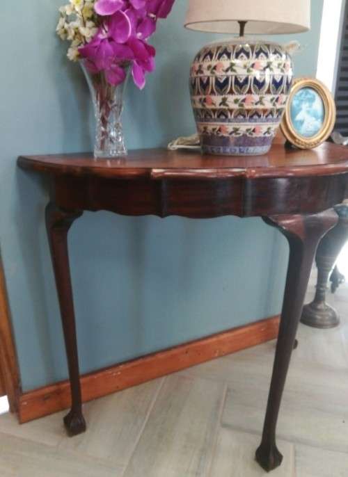 A  vintage solid Imbuia scalloped edge ball & claw half moon display/ occ table.Xmas sale