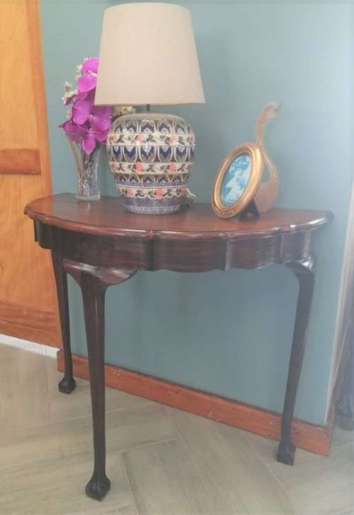 A  vintage solid Imbuia scalloped edge ball & claw half moon display/ occ table.Xmas sale