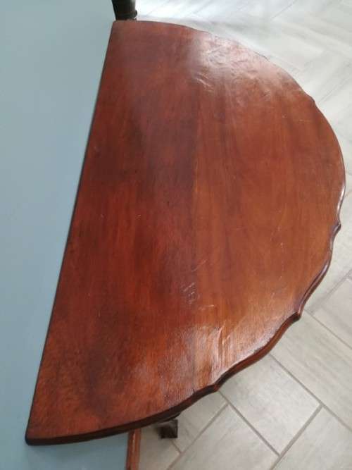 A  vintage solid Imbuia scalloped edge ball & claw half moon display/ occ table.Xmas sale