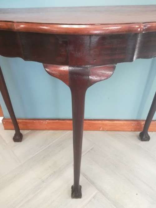 A  vintage solid Imbuia scalloped edge ball & claw half moon display/ occ table.Xmas sale