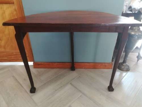 A  vintage solid Imbuia scalloped edge ball & claw half moon display/ occ table.Xmas sale