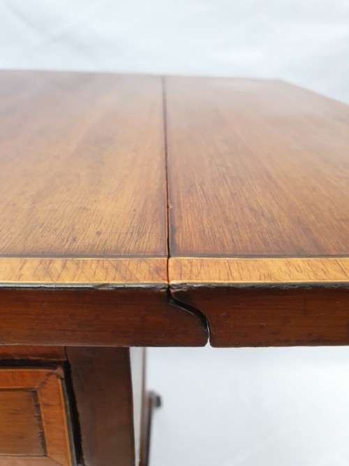 A very stylish drop side two drawer games/ card table.