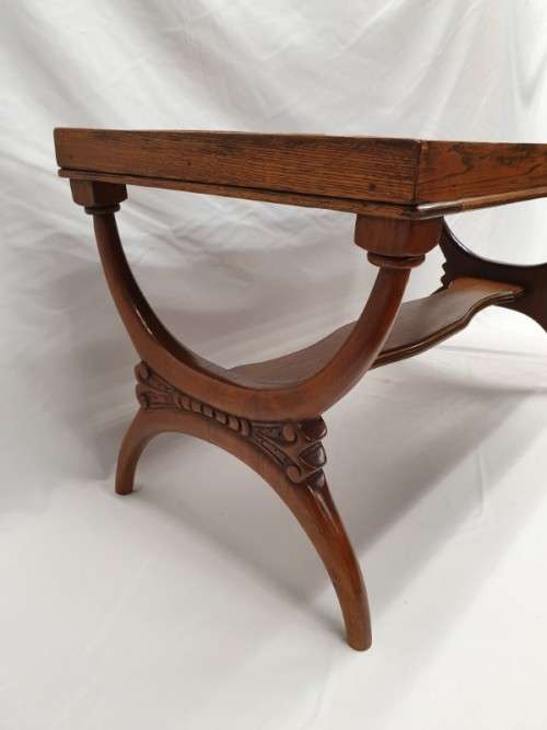 A carved Oak coffee table in good condition.Perfect in informal areas-Xmas Sale