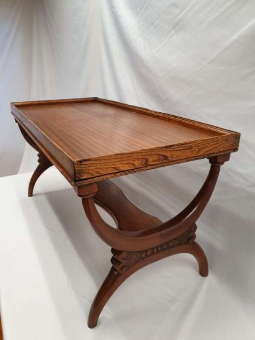 A carved Oak coffee table in good condition.Perfect in informal areas-Xmas Sale
