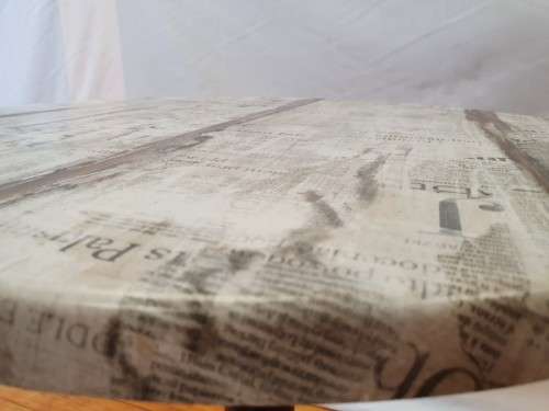 A lovely cafe style round table with newspaper print for indoor or outdoor use.-Xmas sale