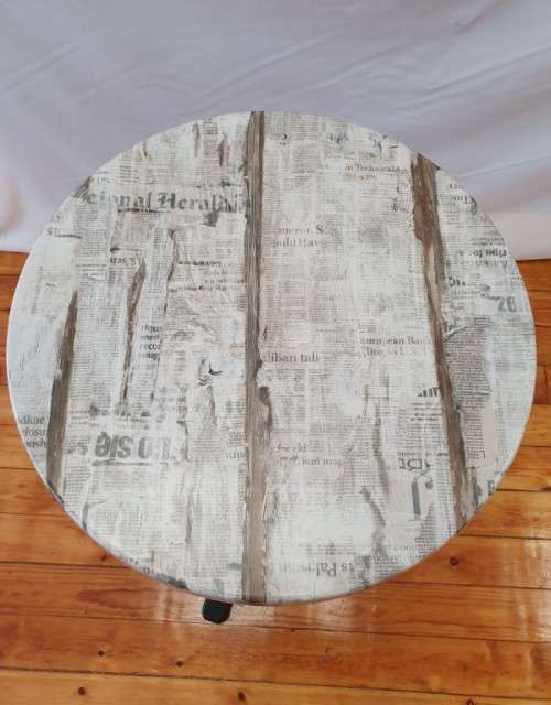 A lovely cafe style round table with newspaper print for indoor or outdoor use.-Xmas sale
