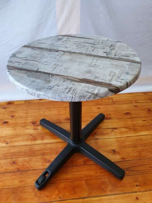A lovely cafe style round table with newspaper print for indoor or outdoor use.-Xmas sale