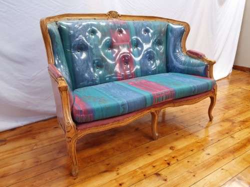 A well made antique Victorian 2 seater settee couch w carved detailing. Xmas sale