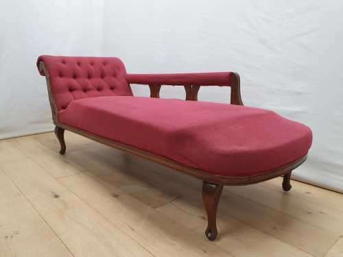 An Edwardian rail-back upholstered Chaise Lounge