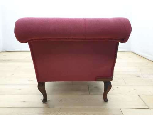 An Edwardian rail-back upholstered Chaise Lounge