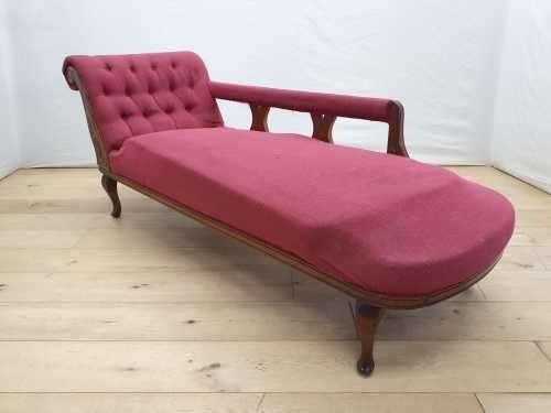 An Edwardian rail-back upholstered Chaise Lounge