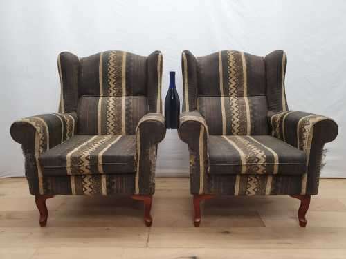 A pair of vintage Queen Anne footed Wingback upholstered arm chairs