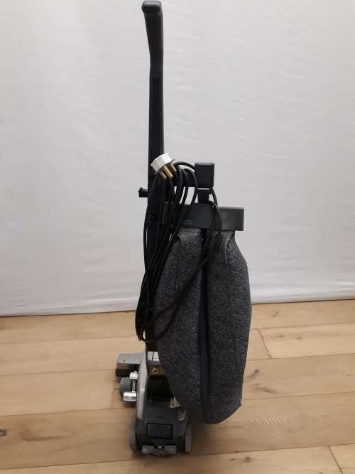 A Kirby vacuum cleaner in working order and a spare for parts (not working)
