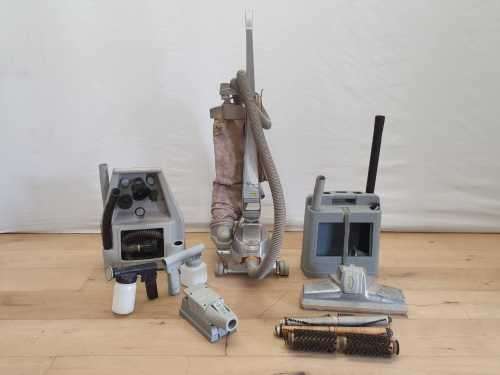 A Kirby vacuum cleaner in working order with extra attachments