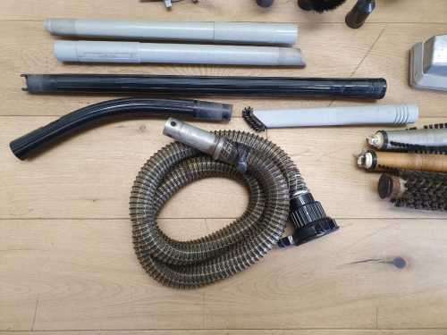 A Kirby vacuum cleaner in working order with extra attachments