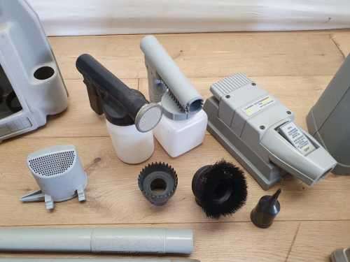 A Kirby vacuum cleaner in working order with extra attachments
