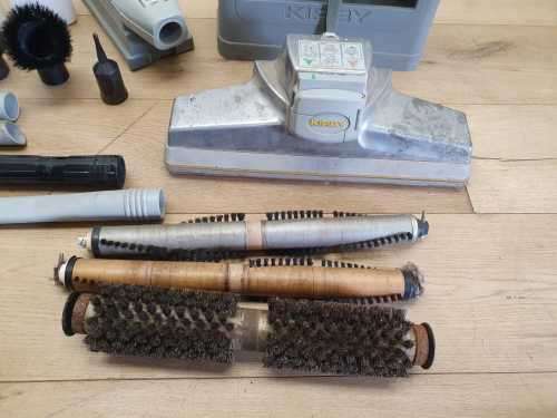 A Kirby vacuum cleaner in working order with extra attachments