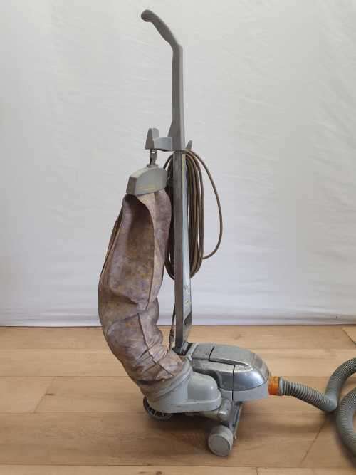 A Kirby vacuum cleaner in working order with extra attachments