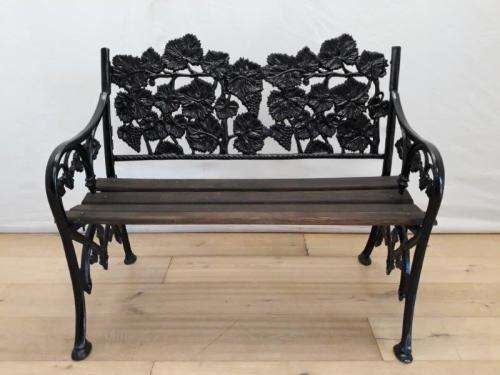 A cast iron "MFM Zimbabwe" slatted wood all weather garden/ patio bench.