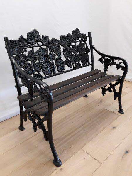 A cast iron "MFM Zimbabwe" slatted wood all weather garden/ patio bench.