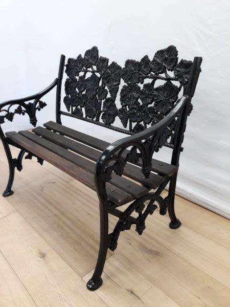 A cast iron "MFM Zimbabwe" slatted wood all weather garden/ patio bench.