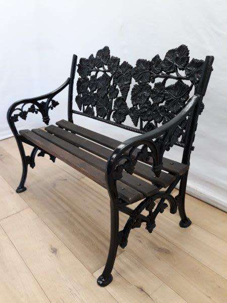 A cast iron "MFM Zimbabwe" slatted wood all weather garden/ patio bench.