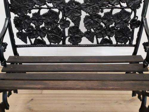 A cast iron "MFM Zimbabwe" slatted wood all weather garden/ patio bench.