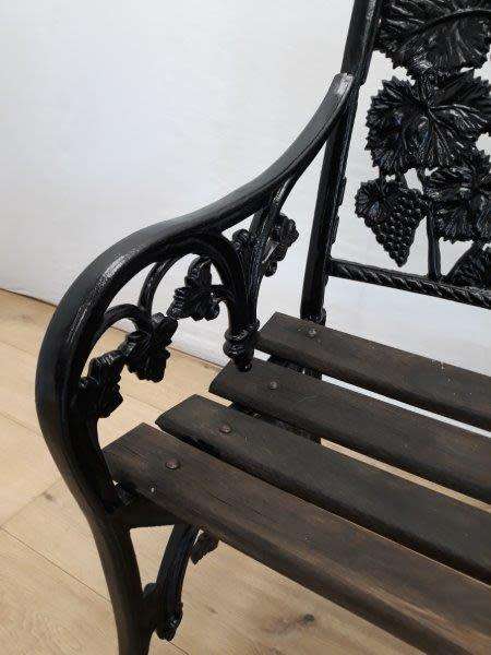 A cast iron "MFM Zimbabwe" slatted wood all weather garden/ patio bench.