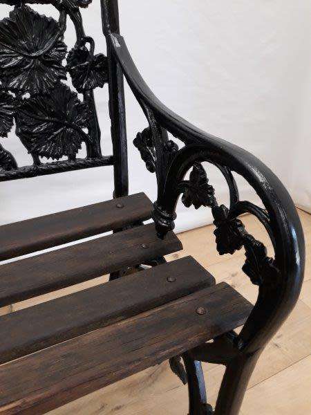 A cast iron "MFM Zimbabwe" slatted wood all weather garden/ patio bench.