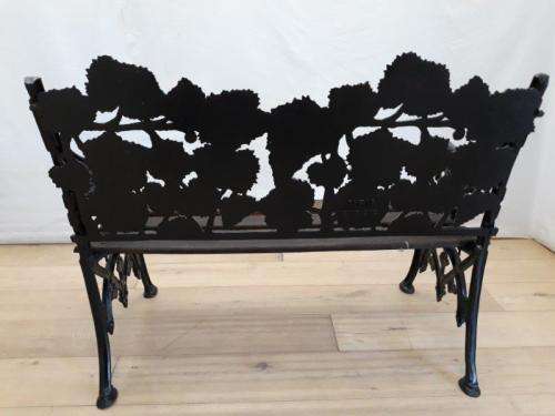 A cast iron "MFM Zimbabwe" slatted wood all weather garden/ patio bench.