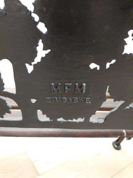 A cast iron "MFM Zimbabwe" slatted wood all weather garden/ patio bench.