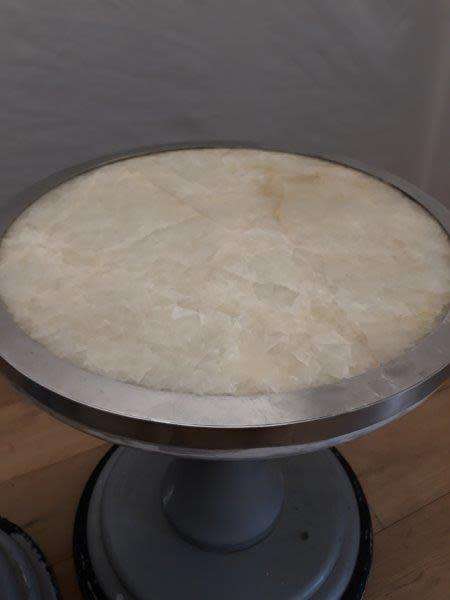 A set of two Marble top round occasional tables