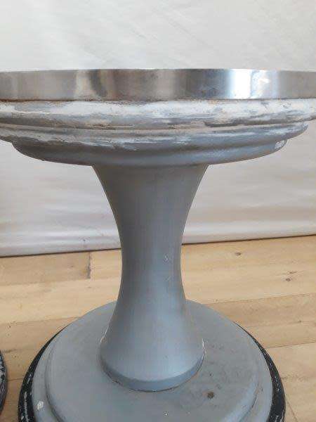 A set of two Marble top round occasional tables