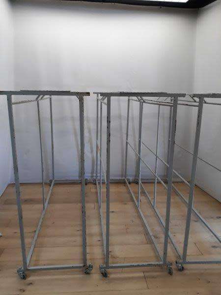 3 industrial size metal clothes hanging rails on wheels