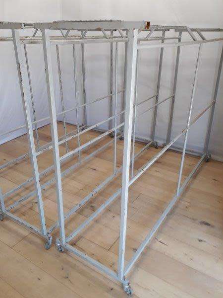 3 industrial size metal clothes hanging rails on wheels